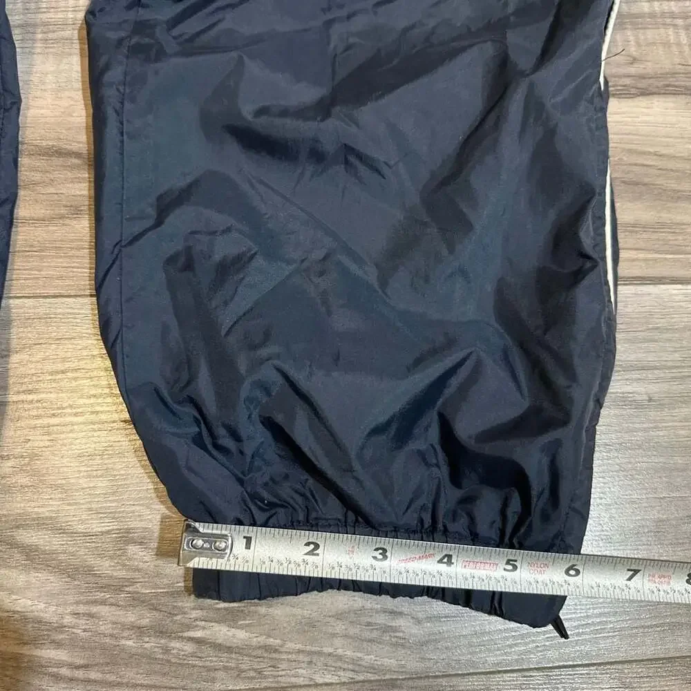 Vintage Men's Navy Blue Nylon Track Pants with White Side Piping and Zip Cuffs